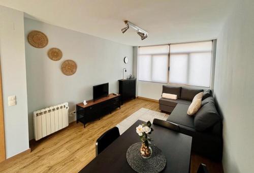 a living room with a couch and a table at Apartamento 1 in Madrid