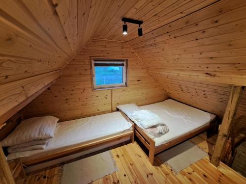 Postel nebo postele na pokoji v ubytování Agroturystyka Skoszewo