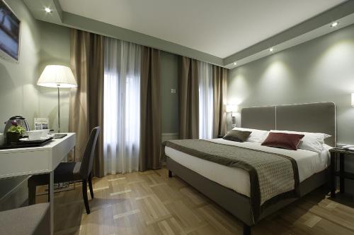 Hotel Forte del 48にあるベッド