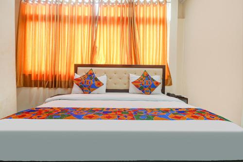 Voodi või voodid majutusasutuse FabHotel Lotus Park toas