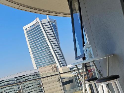a view of a tall building from a window at Ellipse Waterfall Luxury Apartments in Midrand