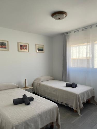 Säng eller sängar i ett rum på Apartamento La Nao