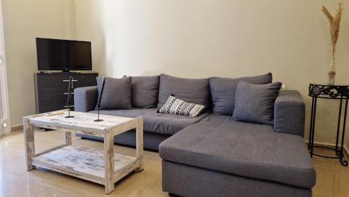 a living room with a couch and a coffee table at Aventora Apartments in Lygia