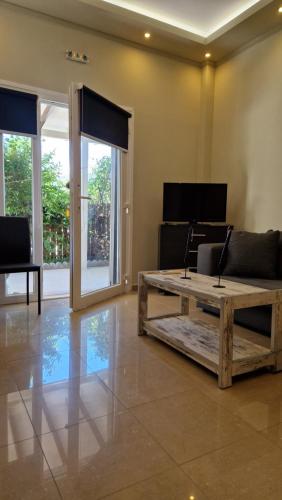 a living room with a couch and a coffee table at Aventora Apartments in Lygia