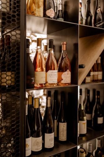 a bunch of bottles of wine in a cellar at FAVAI HILLS your secret hideaway in Brenzone sul Garda