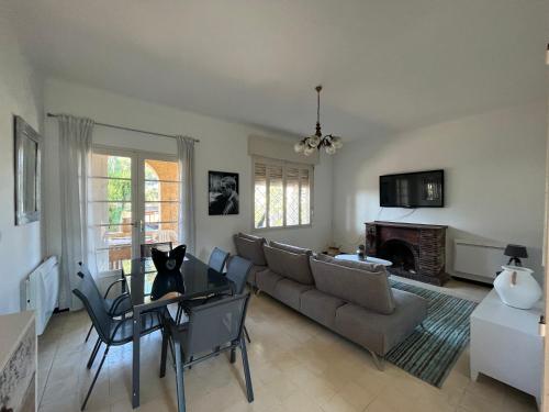 a living room with a couch and a table at CAPELAN in Bandol