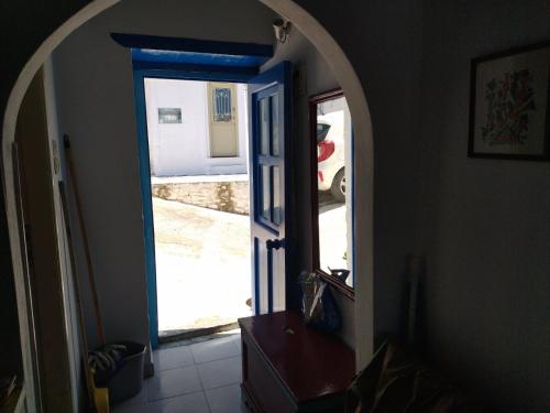 a hallway with an open door to a driveway at KARAI in Astypalaia Town