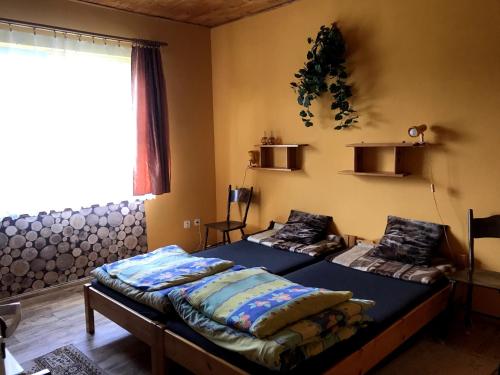 Ένα ή περισσότερα κρεβάτια σε δωμάτιο στο Mazury - Domki letniskowe u Teresy