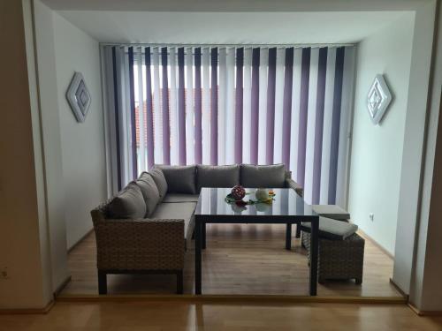 a living room with a couch and a table at Ferienwohnung Familie Wieser in Liebenfels