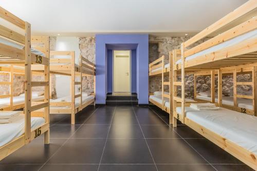 a room with a bunch of bunk beds at One more time Tučepi in Tučepi
