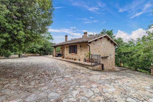 a brick house with a driveway in front of it at Quercia Close By to Montepulciano - Happy Rentals in Montepulciano