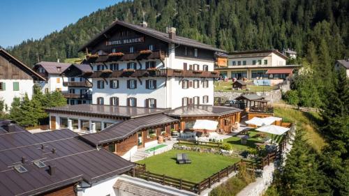 an aerial view of a large building in a village at Wellness Hotel Bladen in Sappada