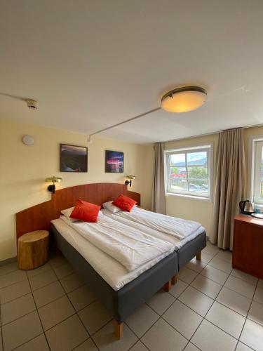 Postel nebo postele na pokoji v ubytování Lilland Brewery Hotel