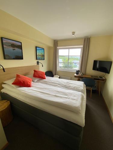 Postel nebo postele na pokoji v ubytování Lilland Brewery Hotel