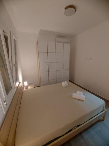 a large bed in a room with a window at VILLA L&M in Floridia