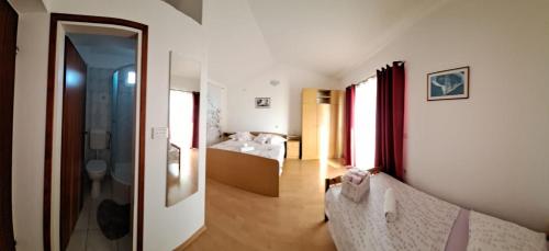 Ένα ή περισσότερα κρεβάτια σε δωμάτιο στο Apartments Garac