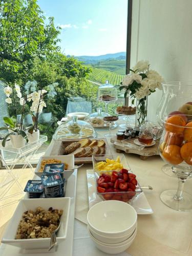 a table with a buffet of food on a table at Zuani Casa in San Floriano del Cóllio