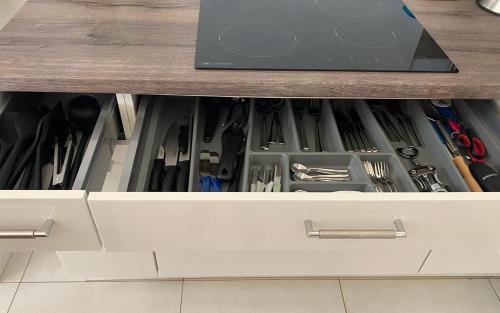 a drawer filled with tools in a cabinet at Vila Mare - Praia de Chaves frontline in Cabeçadas