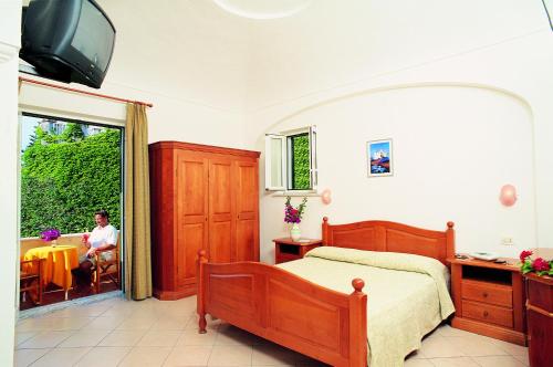 Katil atau katil-katil dalam bilik di Villa Angela Hotel & Spa