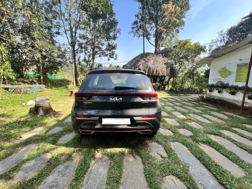 a suv parked in the driveway of a house at Zyamadhari in Mananthavady