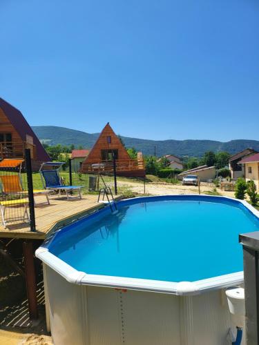 a large swimming pool in a backyard at Chalet en A de la Motte-Fanjas 