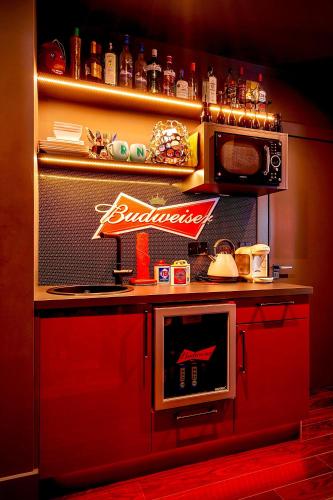 a kitchen with a counter top with a microwave at Nest in Newcastle