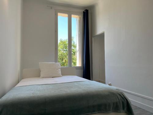 Posteľ alebo postele v izbe v ubytovaní AptCityStay