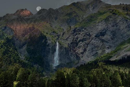 a waterfall on the side of a mountain at Qedi Cottages 