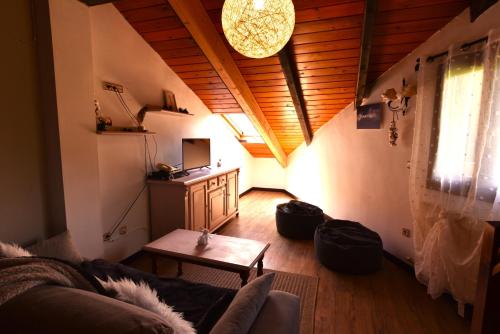 a living room with a couch and a table at Balcon del Pirineo Rural Ordesa in Buesa