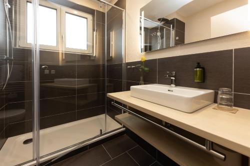 a bathroom with a sink and a shower at Das Hohenried in Freudenstadt
