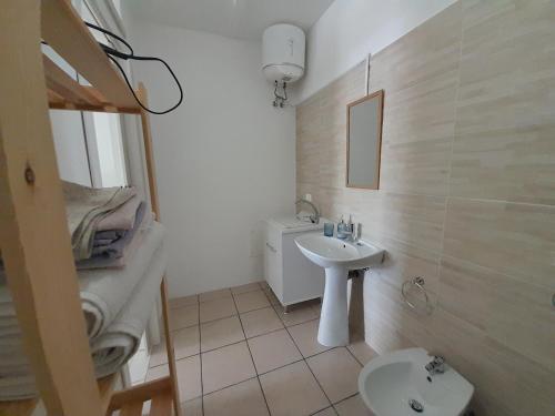 a bathroom with a sink and a toilet at El Paso in Castro di Lecce