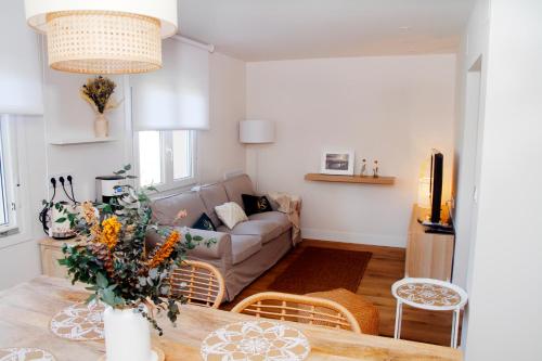 a living room with a couch and a table at TALABERRI in Bermeo