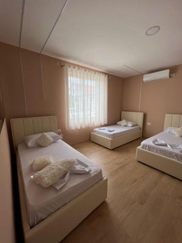 Postel nebo postele na pokoji v ubytování MIQT GUEST HOUSE
