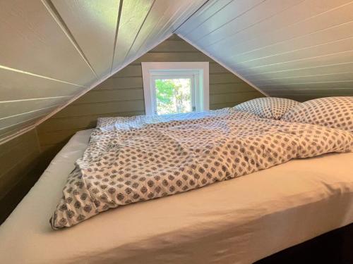 Postel nebo postele na pokoji v ubytování Holiday home OMASTRAND