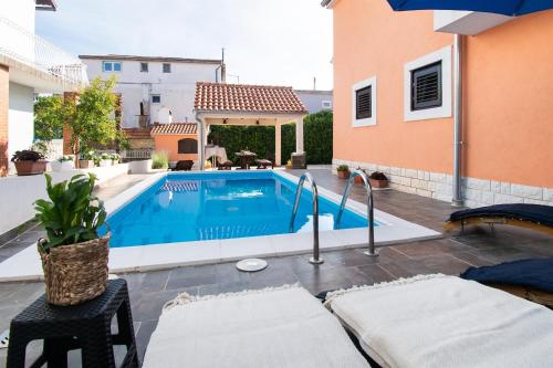 Apartments and Room Agiss with pool