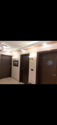 a hallway with two doors and a room with at Hacijenda Vidikovac in Šabac