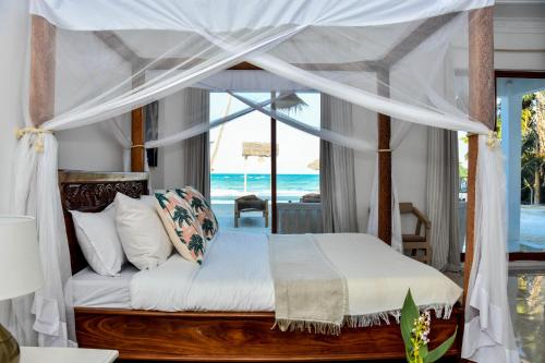 Ένα ή περισσότερα κρεβάτια σε δωμάτιο στο Coral Bay Zanzibar