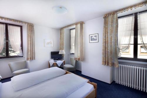 מיטה או מיטות בחדר ב-Hotel Kirchbühl