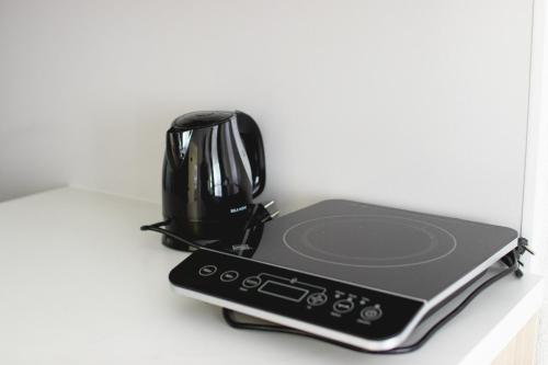 a black blender sitting on top of a counter at Apartments HAN 2 Sarajevo in Sarajevo