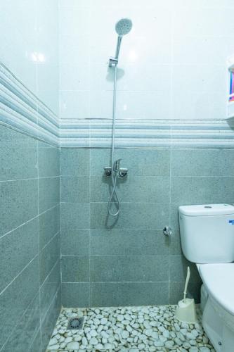 a bathroom with a shower with a toilet at Al-Sabah Residence Agadir in Agadir