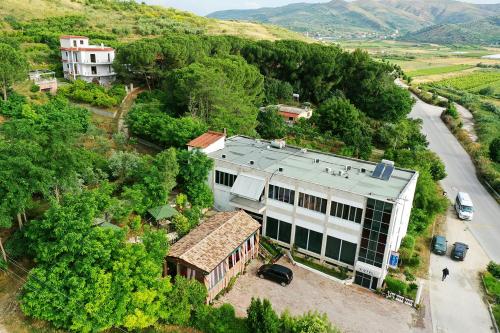 an aerial view of a house on a hill at "Frogs House" Hotel & Restorant Slow Food in Lushnjë