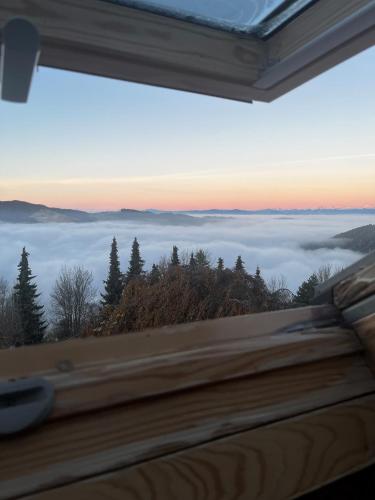 a view from a window of a foggy mountain at Biolandhaus Arche in Eberstein