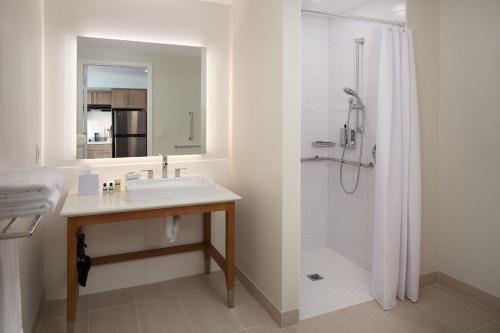 a bathroom with a sink and a shower at Element Orlando International Drive in Orlando