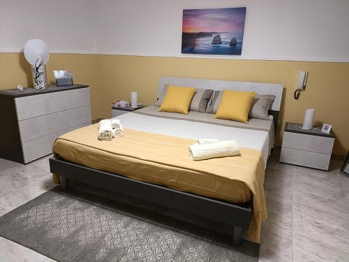 Giường trong phòng chung tại Casa vacanze (Totò e Pompilia)