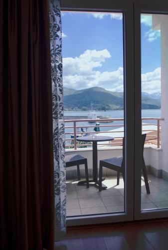a view from a window of a patio with a table at Hotel Aleksandrija in Ohrid