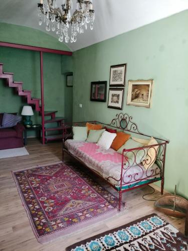 a bedroom with a bed and a rug at Casa relax immersa nel verde della natura in Casalborgone