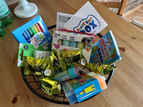 a basket full of toys on a table at Sophia Hameln - maritim wohnen im Weserbergland in Hessisch Oldendorf