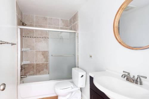 a bathroom with a toilet and a sink and a mirror at Dupont Circle 1BR w WD 2 blocks to Whole Foods WDC-62 in Washington, D.C.