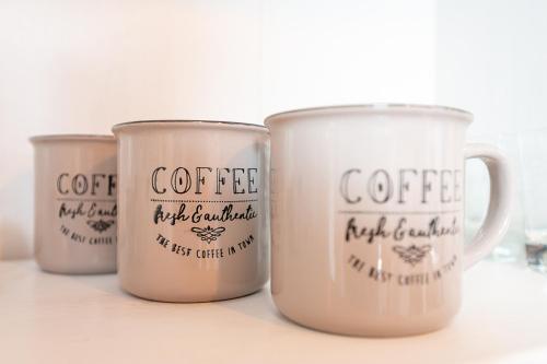 a group of coffee mugs sitting on a table at San Luigi Apartment 2.0 in Beinasco