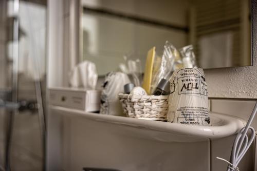 a shelf with a basket on top of a counter at Hotel Grüner Baum in Bühlertal